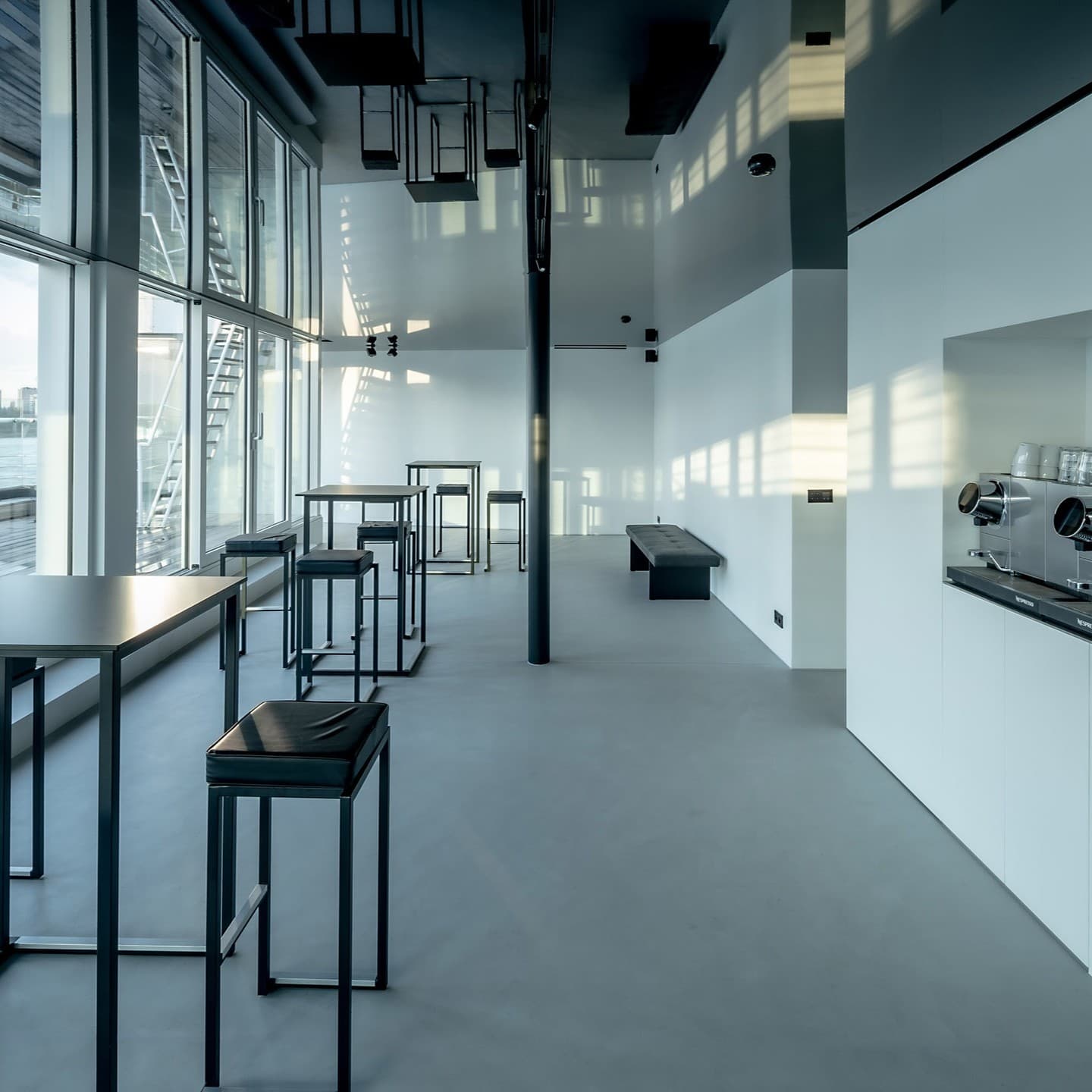 Glossy PVC stretch ceiling reflecting a modern kitchen